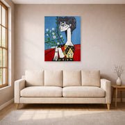 Unframed poster print of Pablo Picasso's 'Jacqueline with Flowers' displayed on a wall in a living room