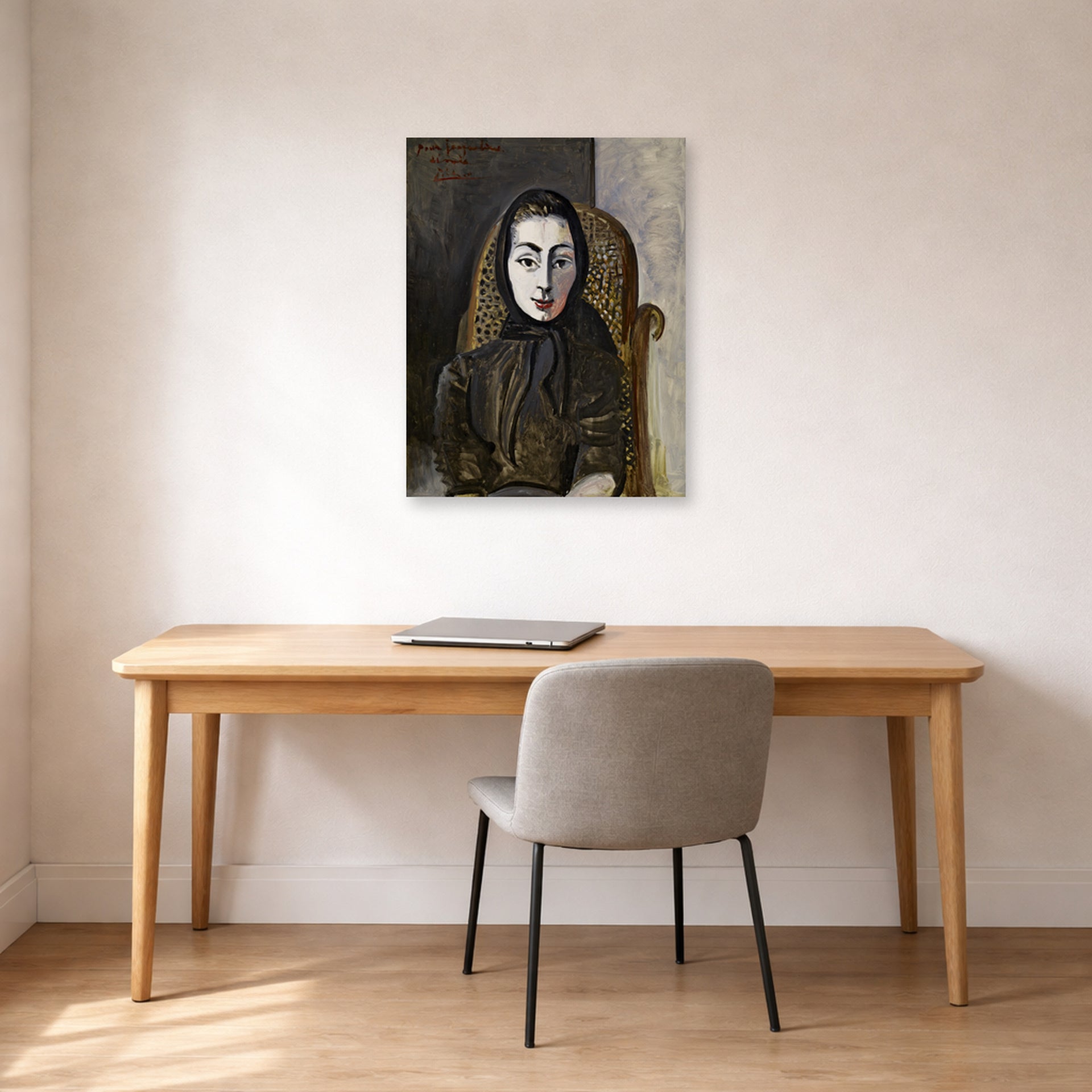 Unframed poster print of Pablo Picasso's 'Jacqueline with a Black Scarf' displayed on a wall in a home office