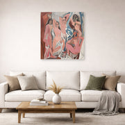 Unframed poster print of Pablo Picasso's 'Les Demoiselles d'Avignon' displayed on a wall in a living room