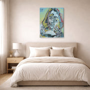 Gallery-wrapped canvas print of Pablo Picasso's 'Man Smoking a Pipe' displayed on a wall in a bedroom
