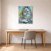 Gallery-wrapped canvas print of Pablo Picasso's 'Man Smoking a Pipe' displayed on a wall in a home office