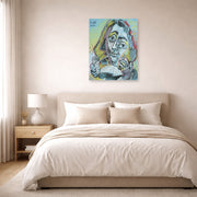 Unframed poster print of Pablo Picasso's 'Man Smoking a Pipe' displayed on a wall in a bedroom