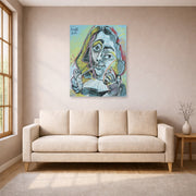 Unframed poster print of Pablo Picasso's 'Man Smoking a Pipe' displayed on a wall in a living room