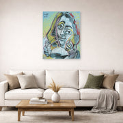 Unframed poster print of Pablo Picasso's 'Man Smoking a Pipe' displayed on a wall in a living room