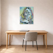 Unframed poster print of Pablo Picasso's 'Man Smoking a Pipe' displayed on a wall in a home office