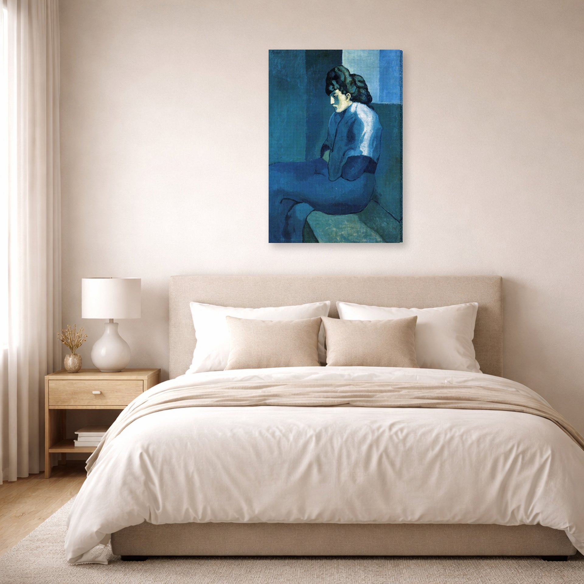 Gallery-wrapped canvas print of Pablo Picasso's 'Melancholy Woman' displayed on a wall in a bedroom