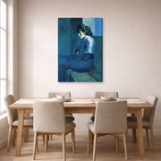 Gallery-wrapped canvas print of Pablo Picasso's 'Melancholy Woman' displayed on a wall in a dining room
