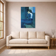 Unframed poster print of Pablo Picasso's 'Melancholy Woman' displayed on a wall in a living room