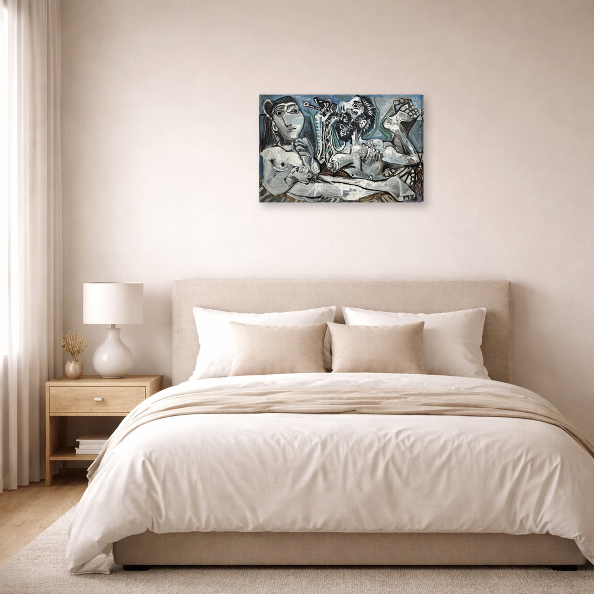 Gallery-wrapped canvas print of Pablo Picasso's 'Nude Lovers' displayed on a wall in a bedroom