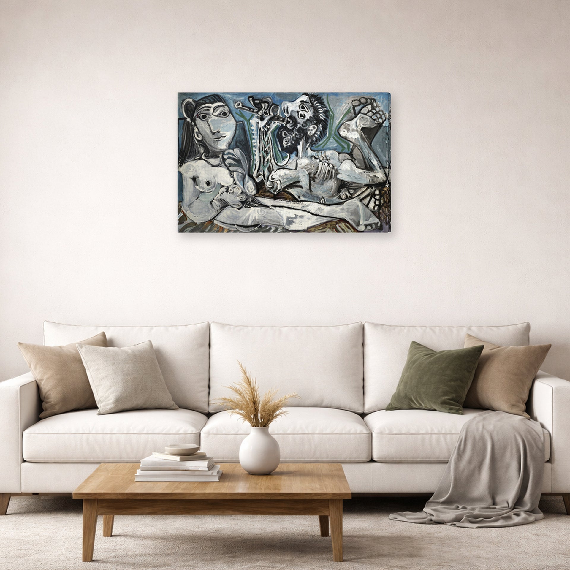 Gallery-wrapped canvas print of Pablo Picasso's 'Nude Lovers' displayed on a wall in a living room