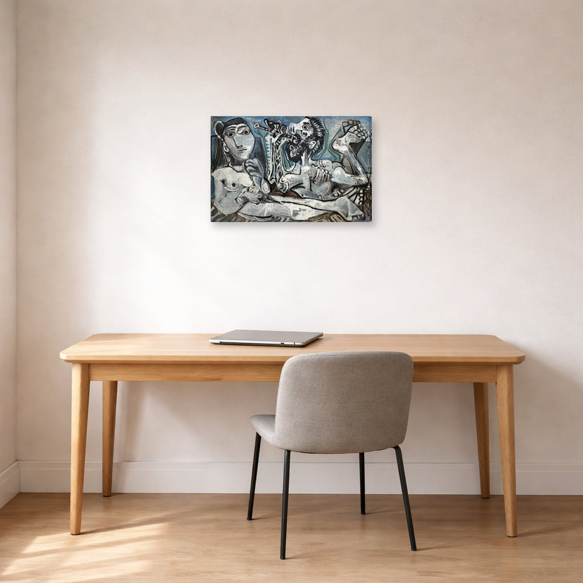 Gallery-wrapped canvas print of Pablo Picasso's 'Nude Lovers' displayed on a wall in a home office