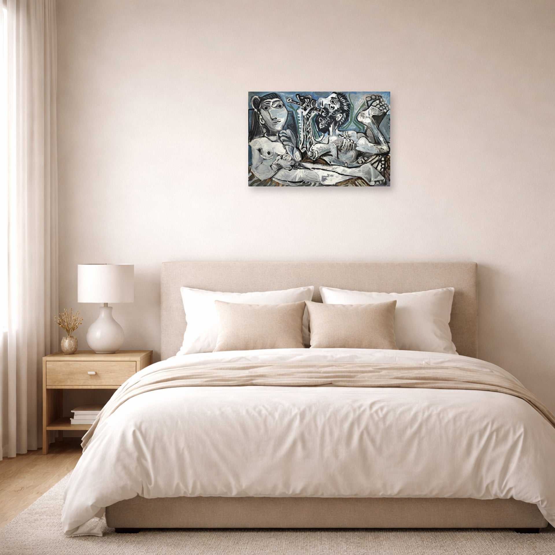 Unframed poster print of Pablo Picasso's 'Nude Lovers' displayed on a wall in a bedroom