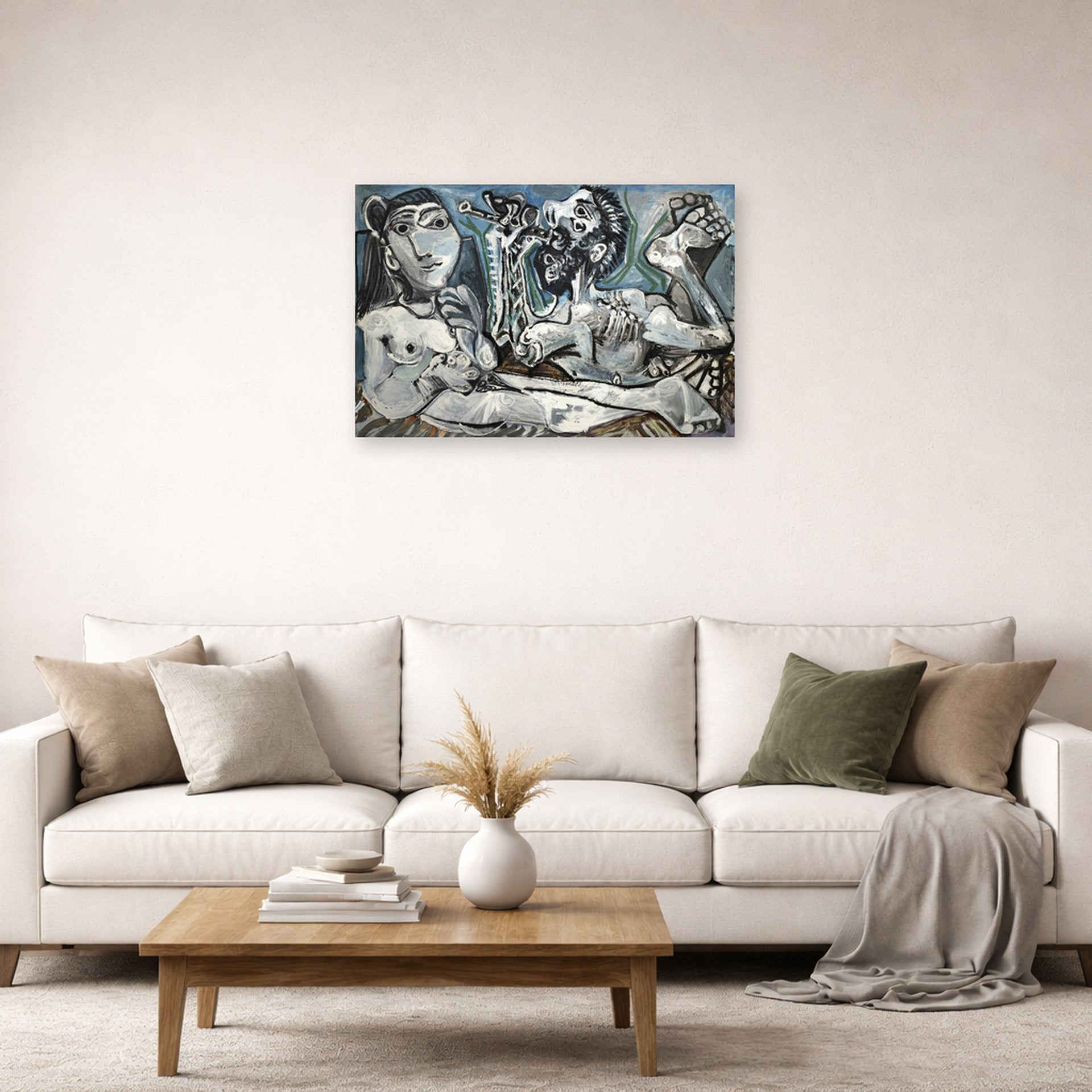 Unframed poster print of Pablo Picasso's 'Nude Lovers' displayed on a wall in a living room