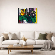 Unframed poster print of Pablo Picasso's 'Pitcher and a Bowl of Fruit' displayed on a wall in a living room