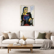 Unframed poster print of Pablo Picasso's 'Portrait of Dora Maar' displayed on a wall in a living room