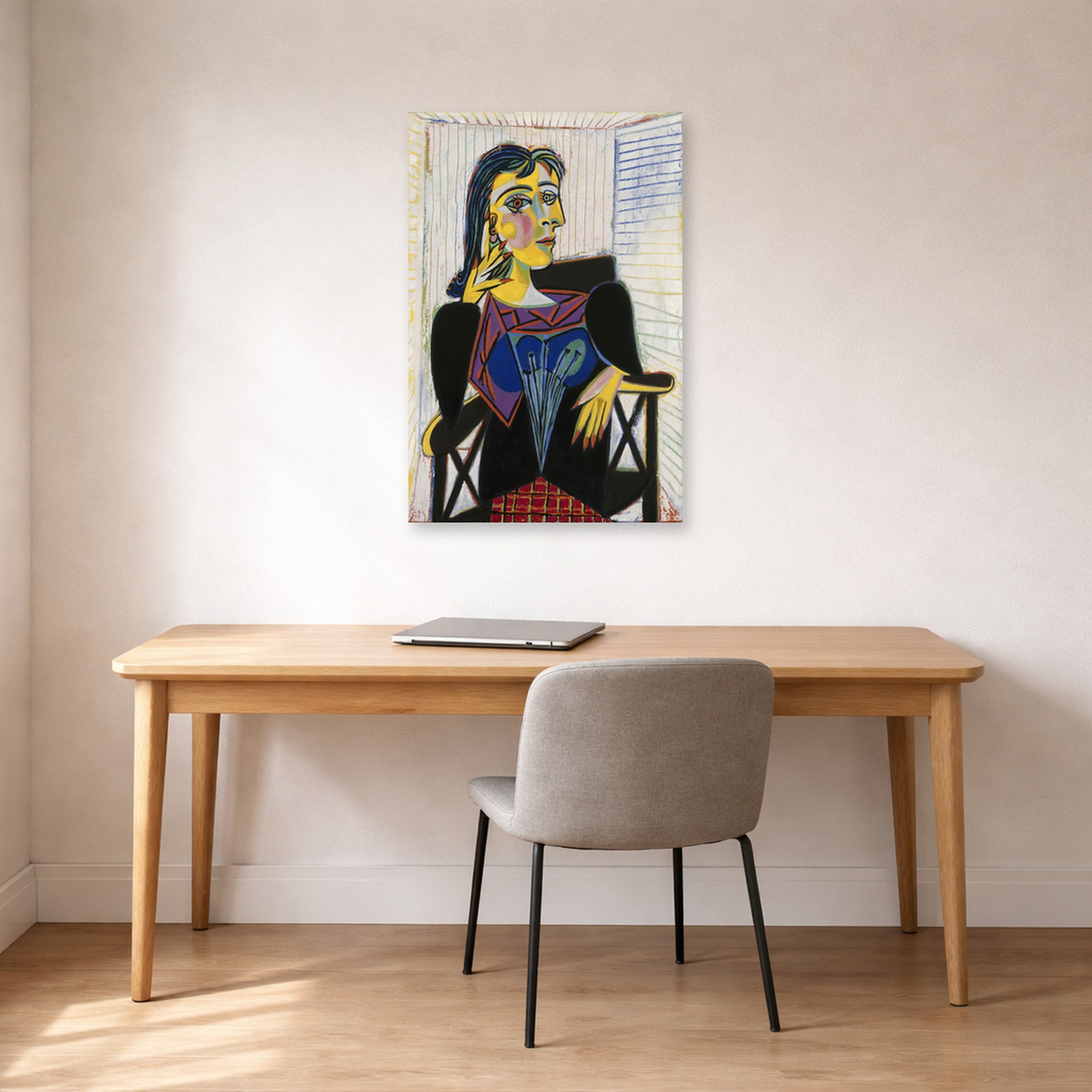 Unframed poster print of Pablo Picasso's 'Portrait of Dora Maar' displayed on a wall in a home office