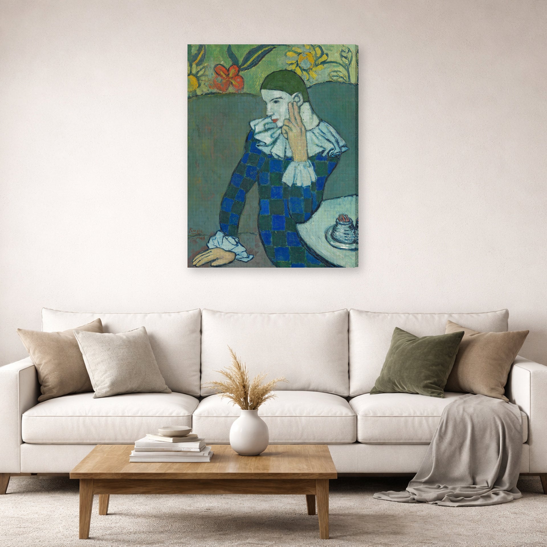 Gallery-wrapped canvas print of Pablo Picasso's 'Seated Harlequin' displayed on a wall in a living room