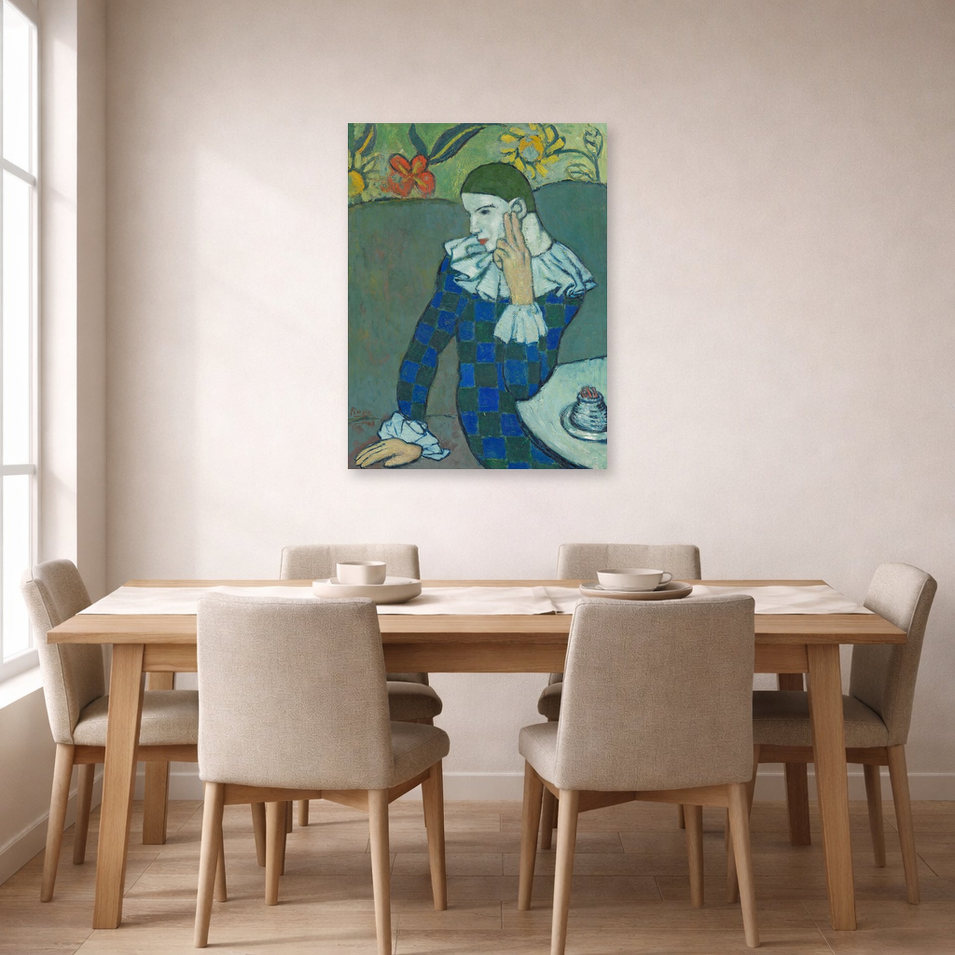 Unframed poster print of Pablo Picasso's 'Seated Harlequin' displayed on a wall in a dining room