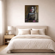 Unframed poster print of Pablo Picasso's 'Seated Woman' displayed on a wall in a bedroom