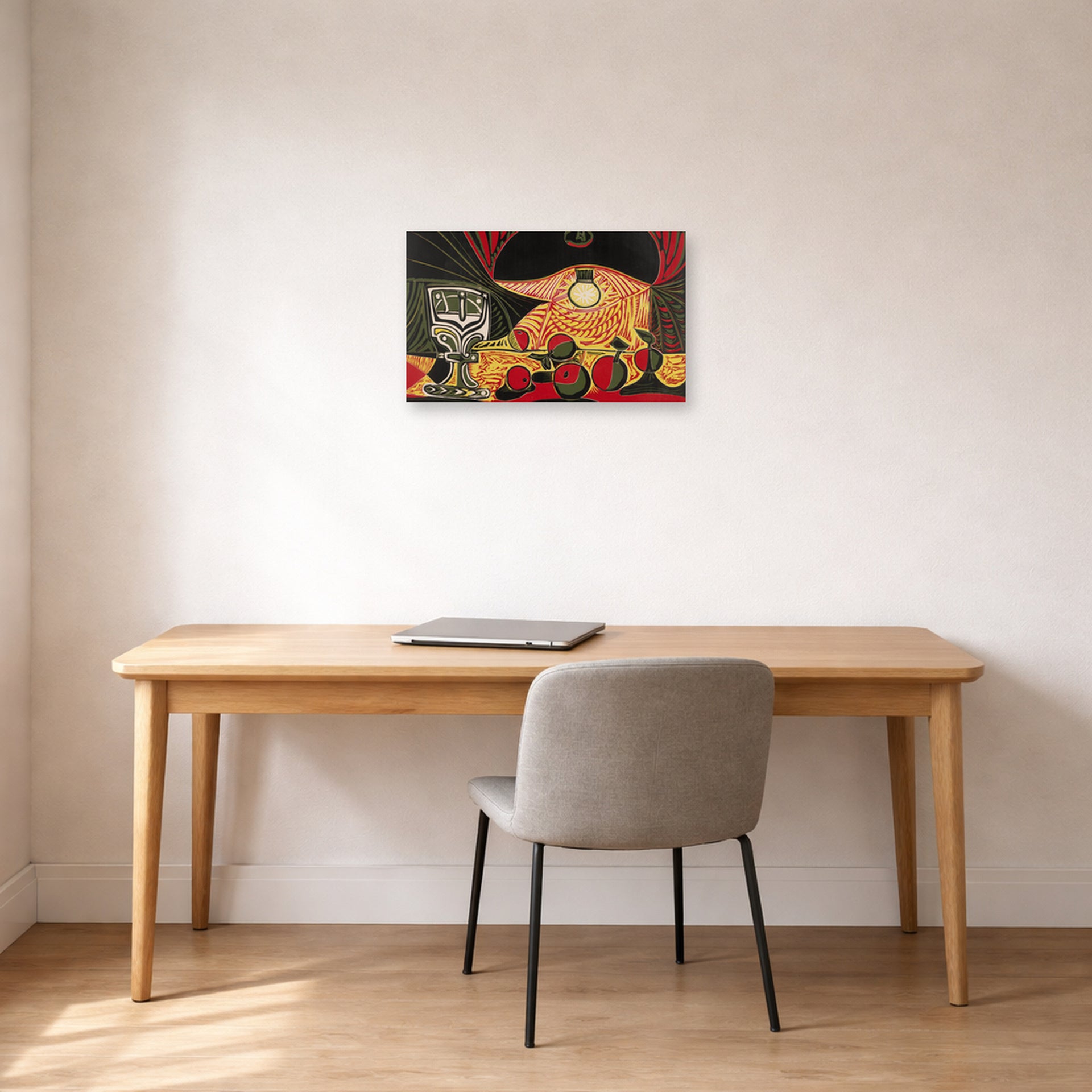 Unframed poster print of Pablo Picasso's 'Still Life Under the Lamp' displayed on a wall in a home office