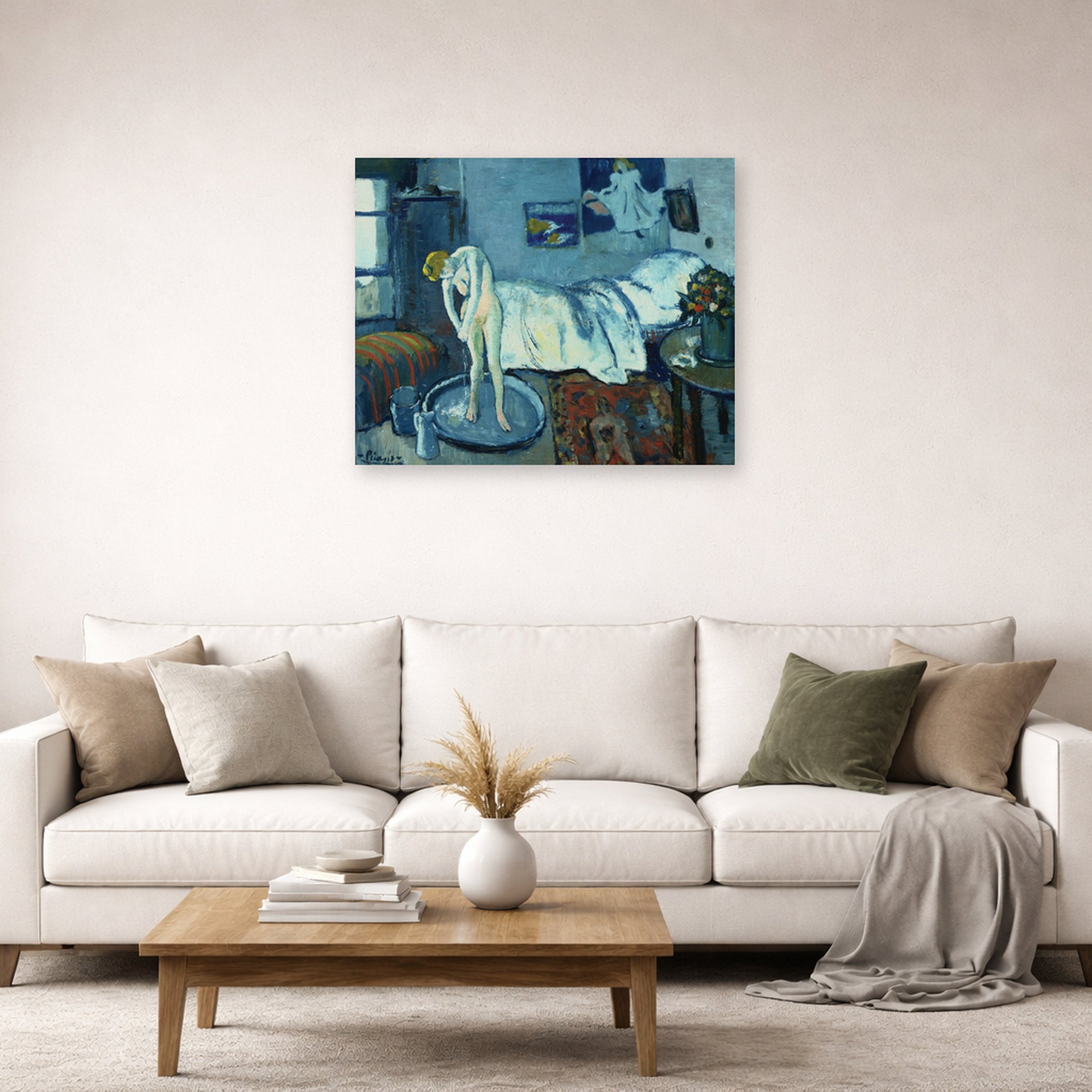 Unframed poster print of Pablo Picasso's 'The Blue Room' displayed on a wall in a living room