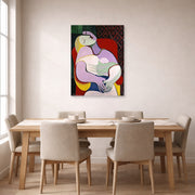 Unframed poster print of Pablo Picasso's 'The Dream' displayed on a wall in a dining room