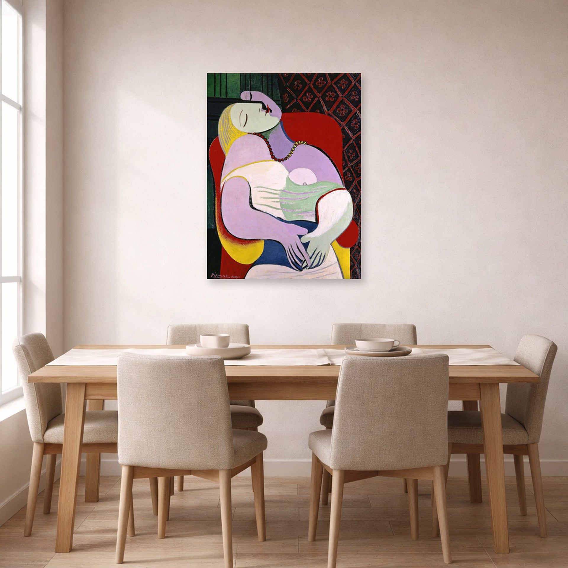 Unframed poster print of Pablo Picasso's 'The Dream' displayed on a wall in a dining room