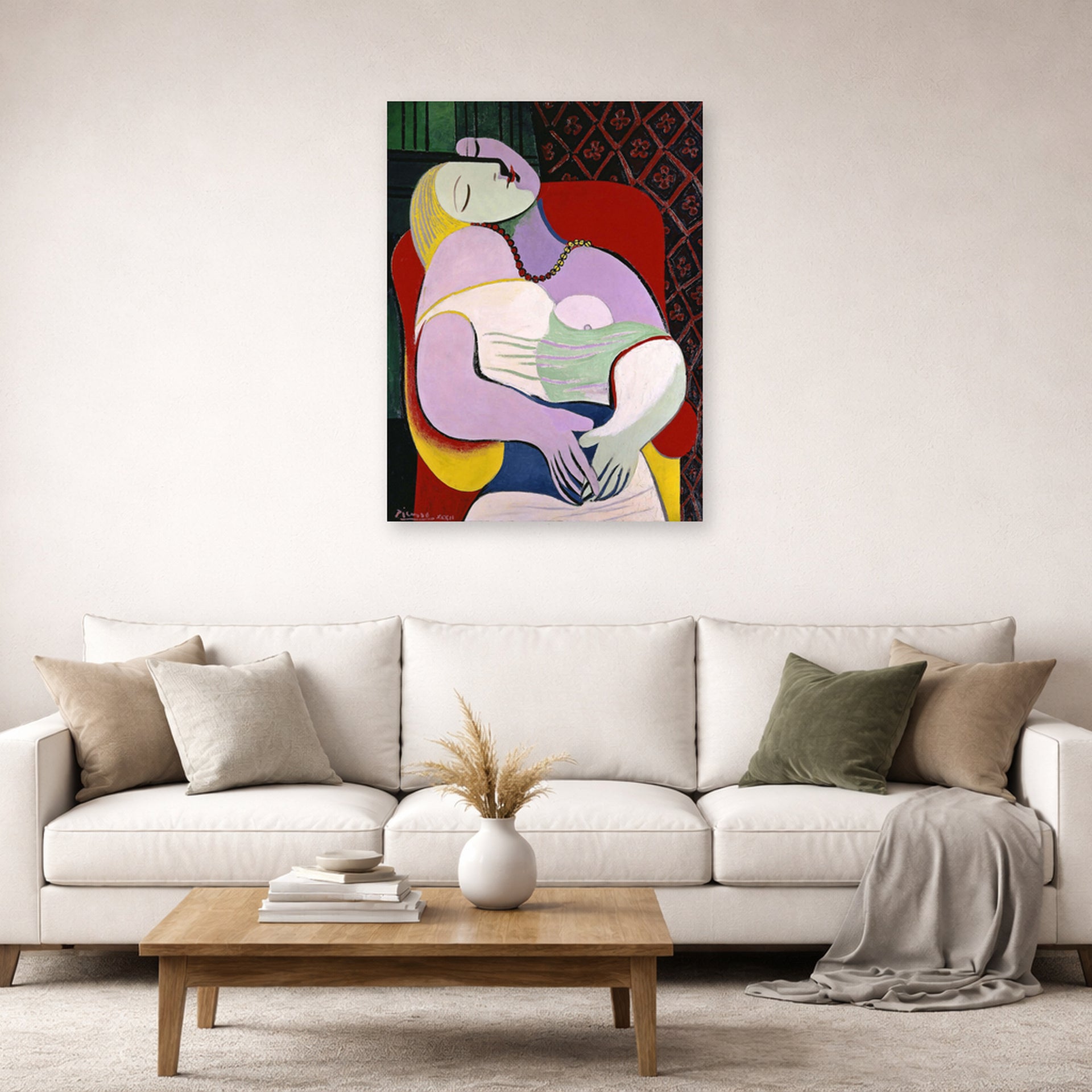 Unframed poster print of Pablo Picasso's 'The Dream' displayed on a wall in a living room