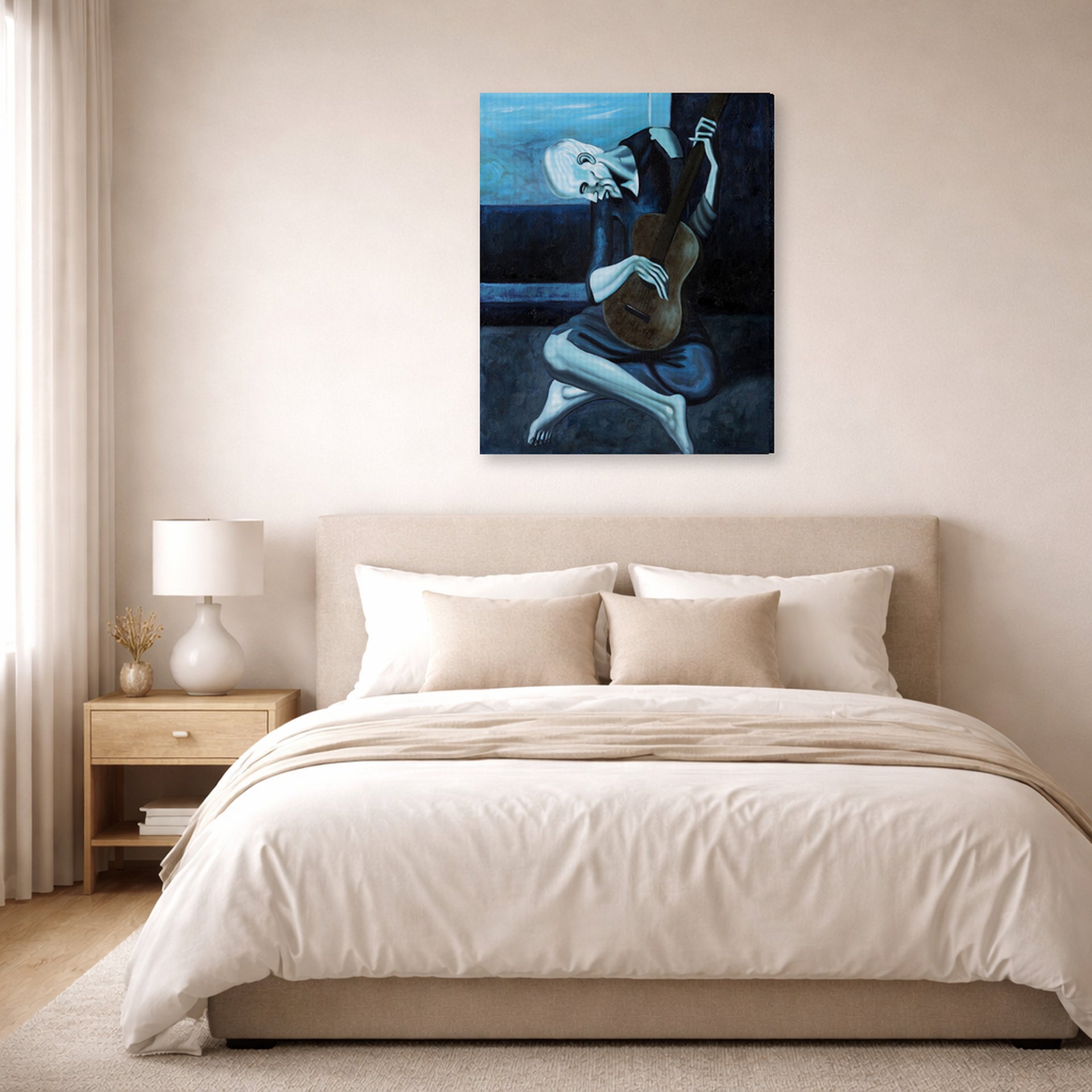 Gallery-wrapped canvas print of Pablo Picasso's 'The Old Guitarist' displayed on a wall in a bedroom