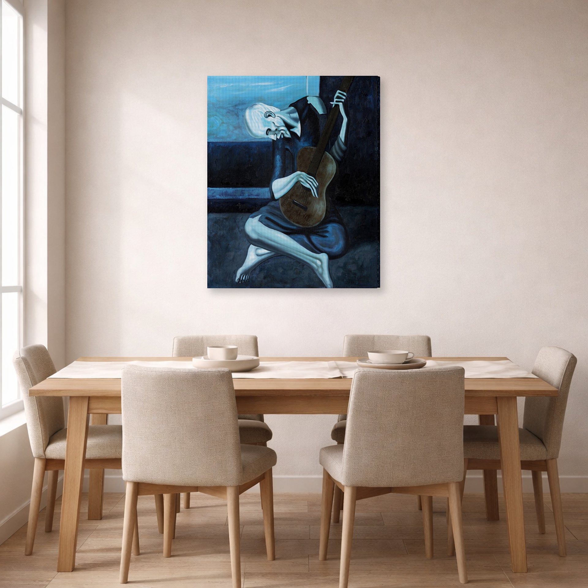 Gallery-wrapped canvas print of Pablo Picasso's 'The Old Guitarist' displayed on a wall in a dining room