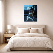 Unframed poster print of Pablo Picasso's 'The Old Guitarist' displayed on a wall in a bedroom