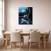 Unframed poster print of Pablo Picasso's 'The Old Guitarist' displayed on a wall in a dining room