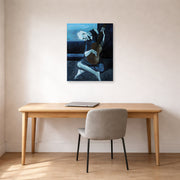 Unframed poster print of Pablo Picasso's 'The Old Guitarist' displayed on a wall in a home office