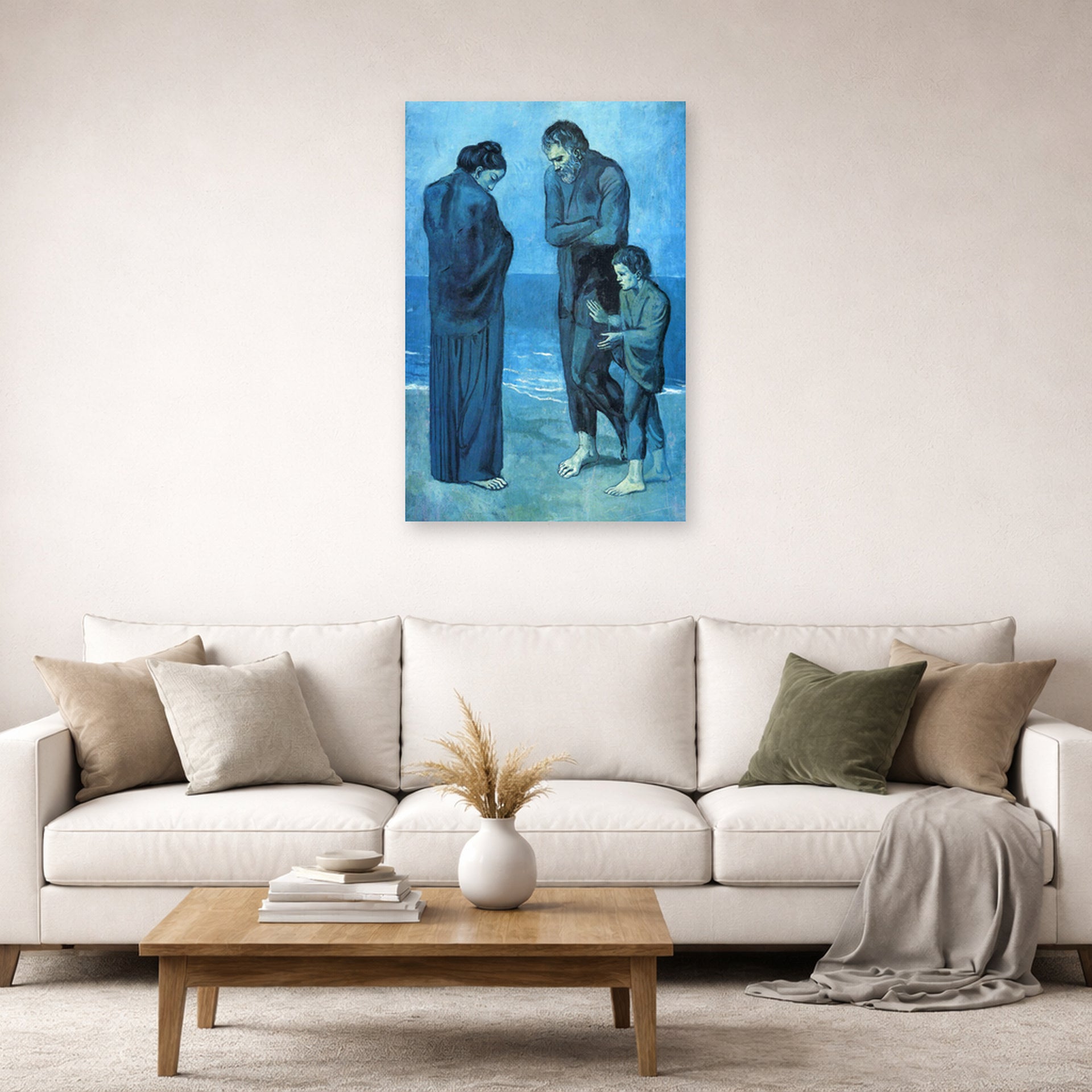 Unframed poster print of Pablo Picasso's 'The Tragedy 1903' displayed on a wall in a living room