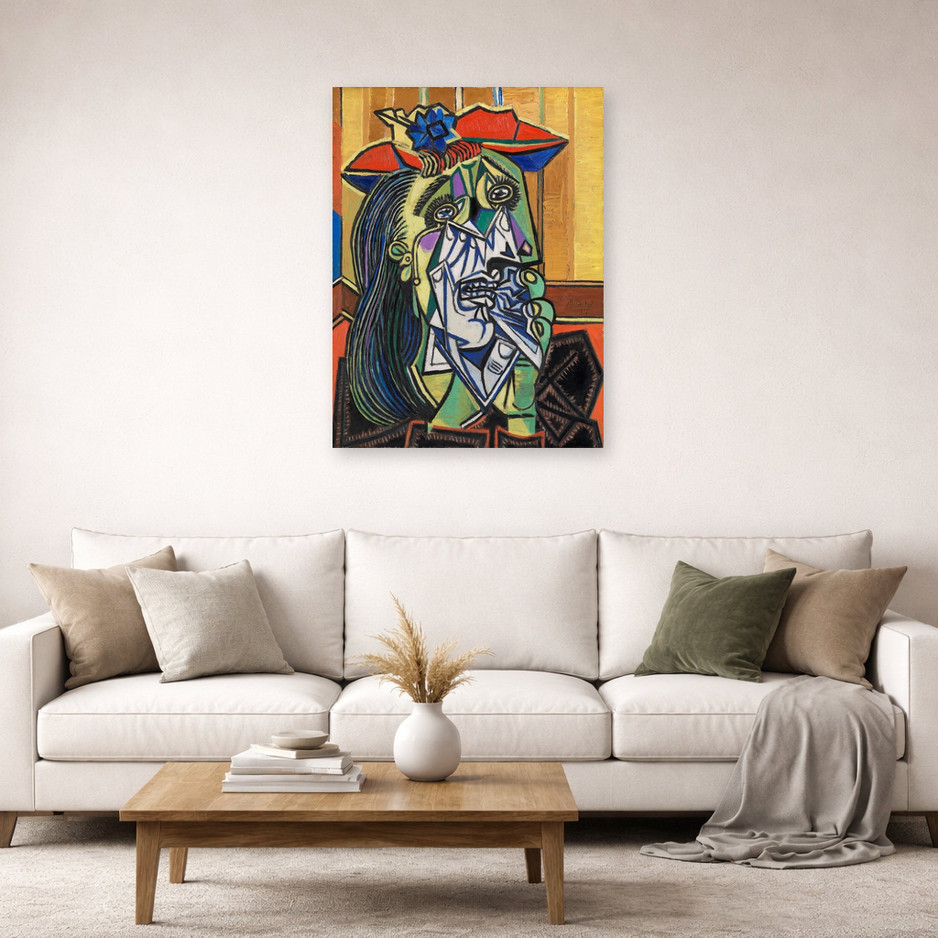 Unframed poster print of Pablo Picasso's 'Weeping Woman' displayed on a wall in a living room