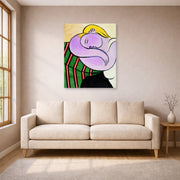 Unframed poster print of Pablo Picasso's 'Woman with Yellow Hair' displayed on a wall in a living room