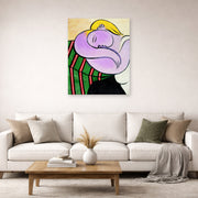 Unframed poster print of Pablo Picasso's 'Woman with Yellow Hair' displayed on a wall in a living room