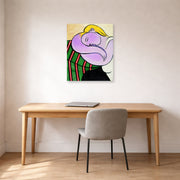 Unframed poster print of Pablo Picasso's 'Woman with Yellow Hair' displayed on a wall in a home office