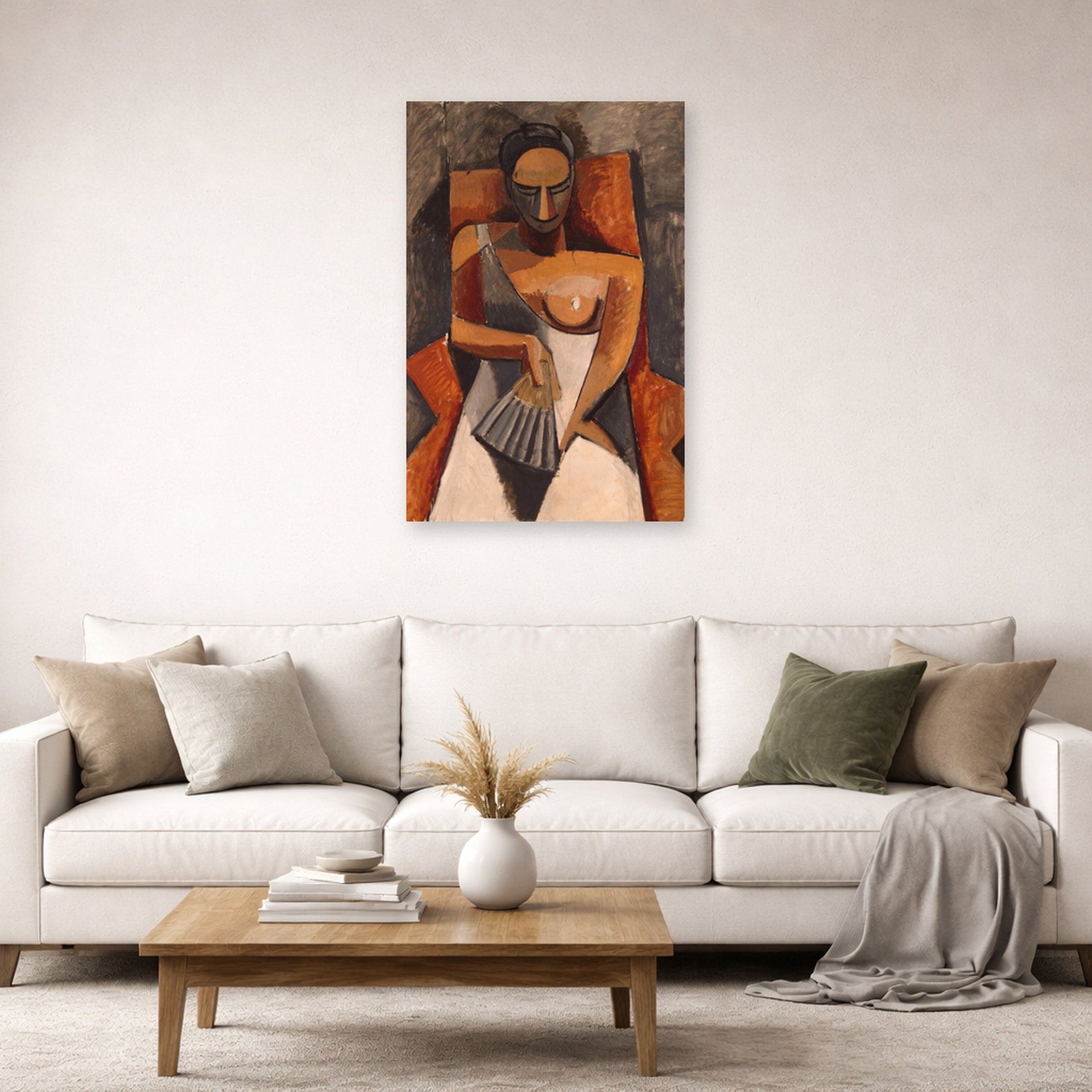 Unframed poster print of Pablo Picasso's 'Woman with a Fan' displayed on a wall in a living room