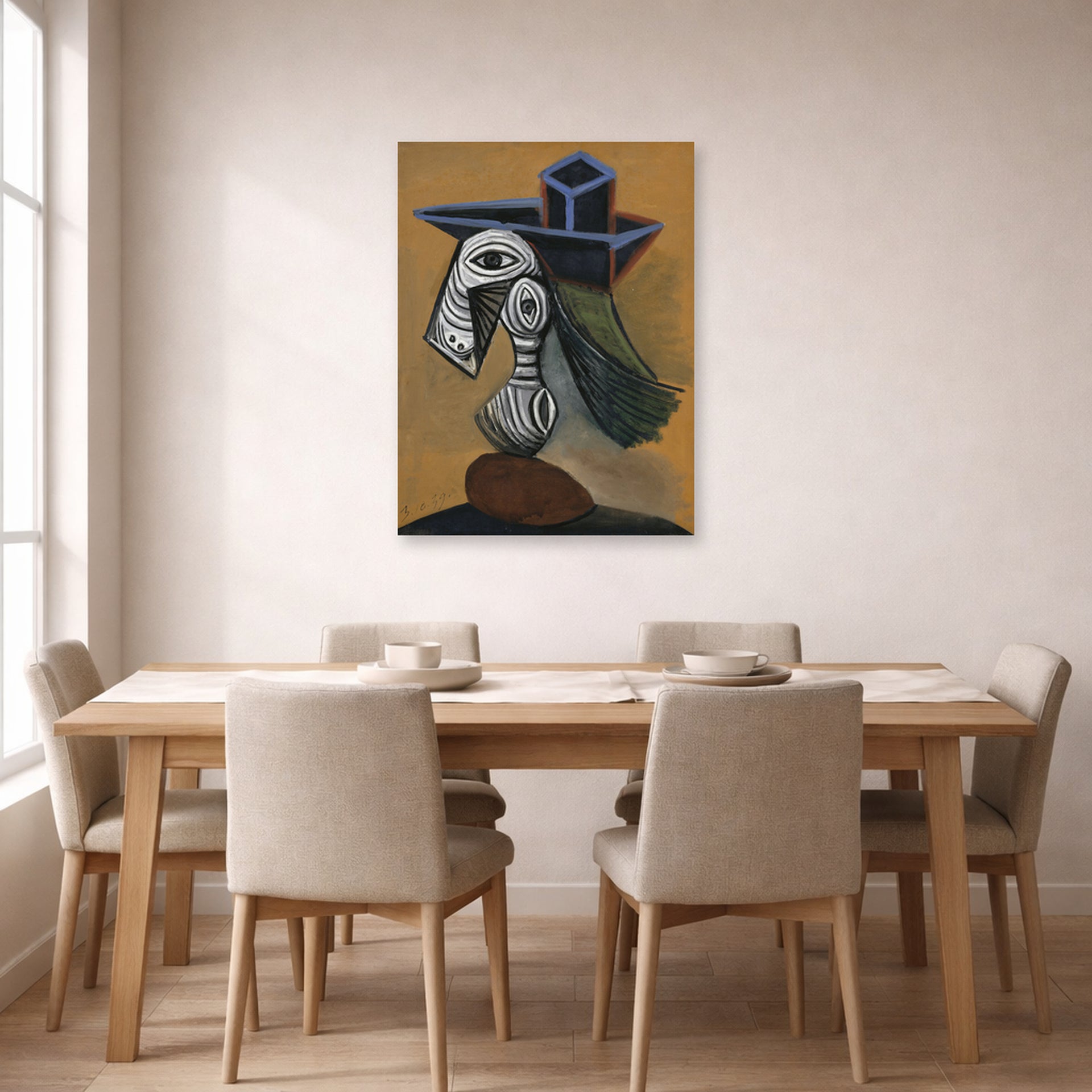 Unframed poster print of Pablo Picasso's 'Woman in a Blue Hat' displayed on a wall in a dining room