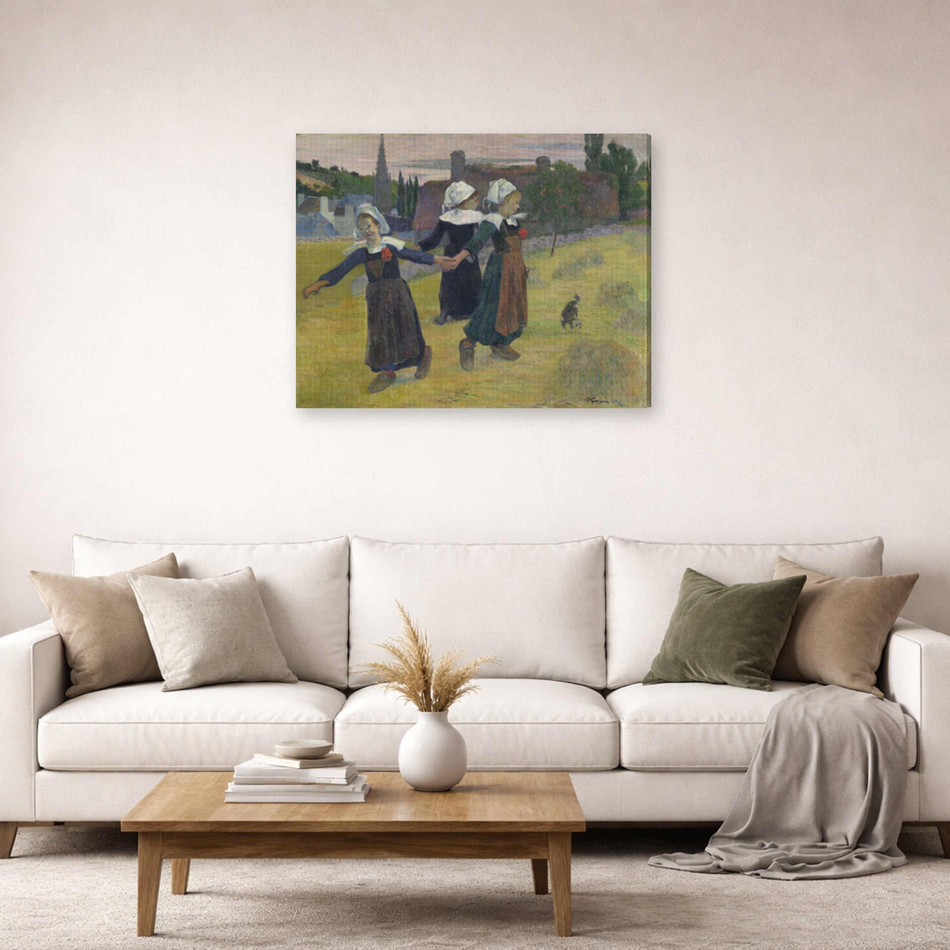 Gallery-wrapped canvas print of Paul Gauguin's Breton Girls Dancing displayed on a wall in a second living room setting
