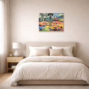 Gallery-wrapped canvas print of Paul Gauguin's Day of the God (Mahana no Atua) displayed on a wall in a bedroom