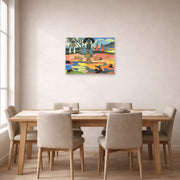 Unframed poster print of Paul Gauguin's Day of the God (Mahana no Atua) displayed on a wall in a dining room