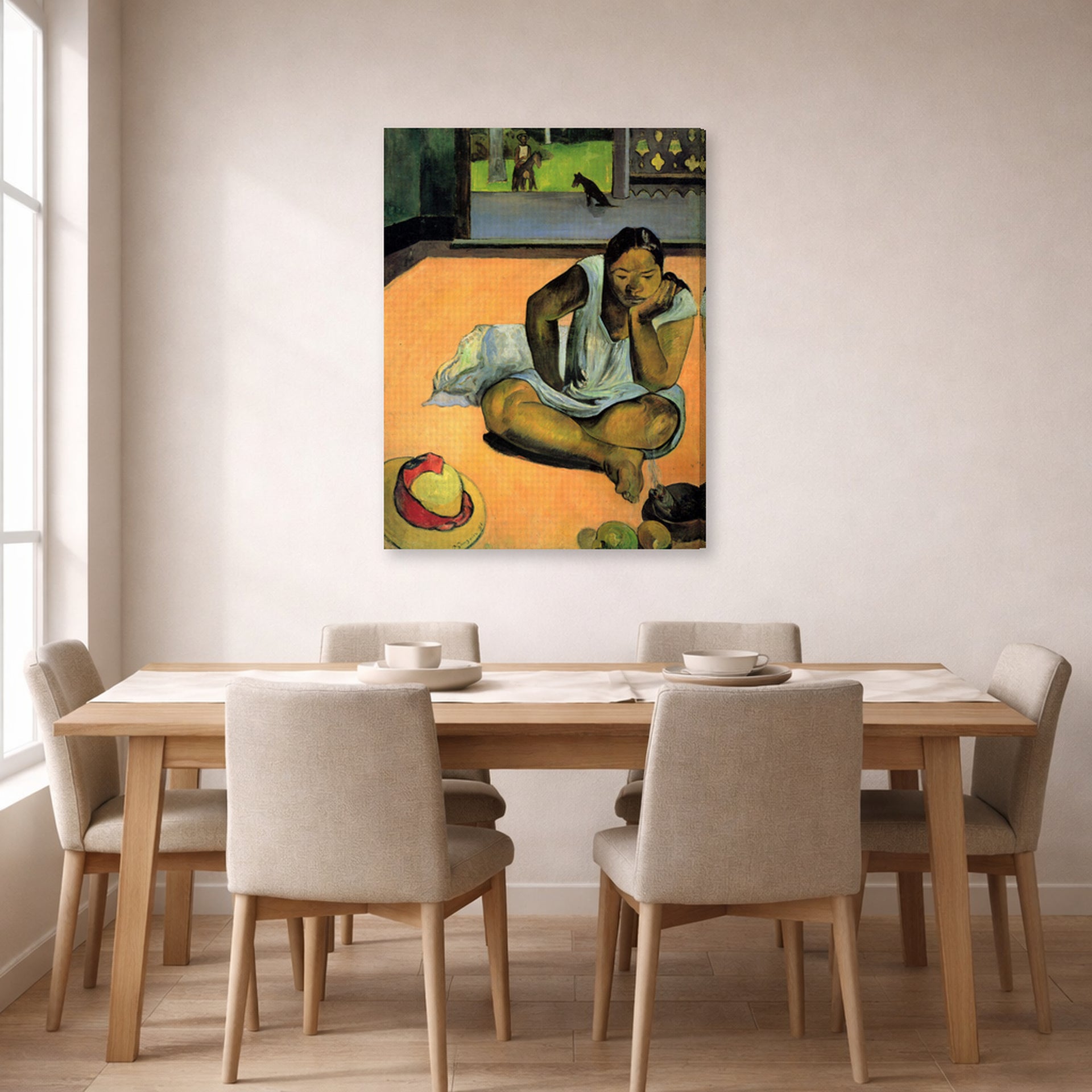 Gallery-wrapped canvas print of Paul Gauguin's The Brooding Woman displayed on a wall in a dining room