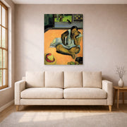 Gallery-wrapped canvas print of Paul Gauguin's The Brooding Woman displayed on a wall in a living room