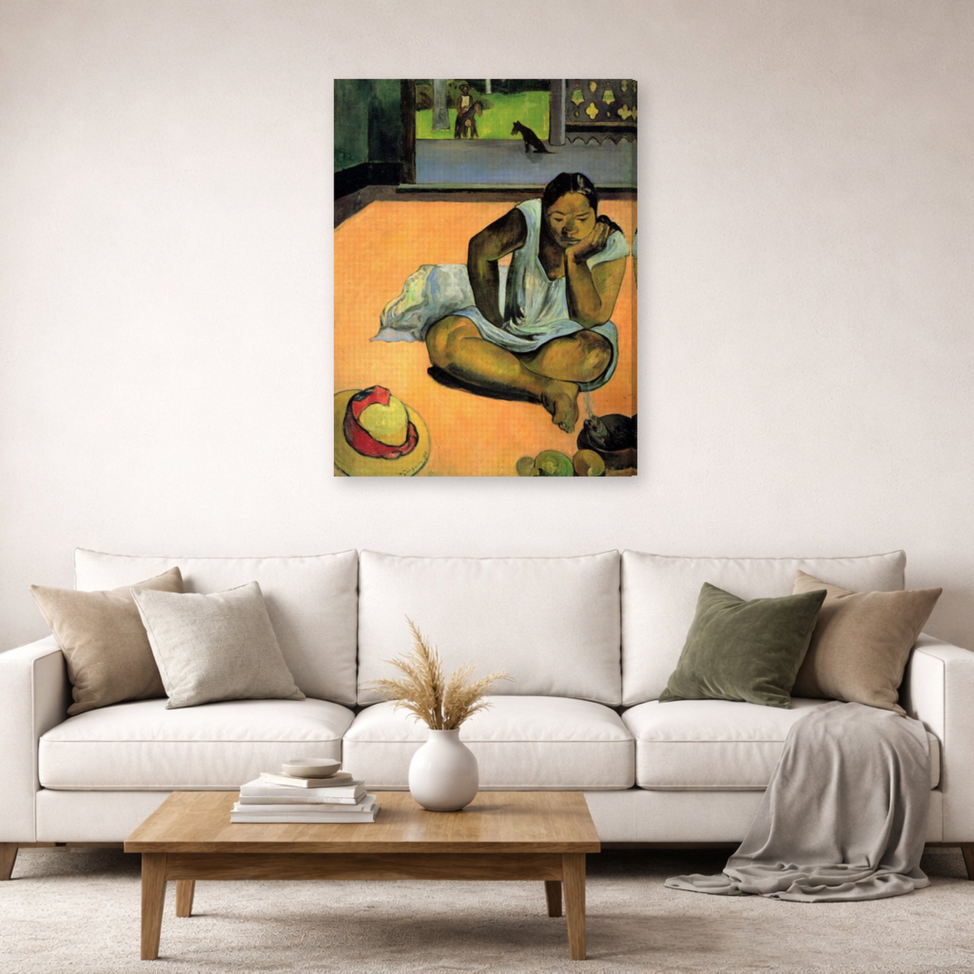 Gallery-wrapped canvas print of Paul Gauguin's The Brooding Woman displayed on a wall in a second living room setting