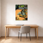 Gallery-wrapped canvas print of Paul Gauguin's The Brooding Woman displayed on a wall in an office
