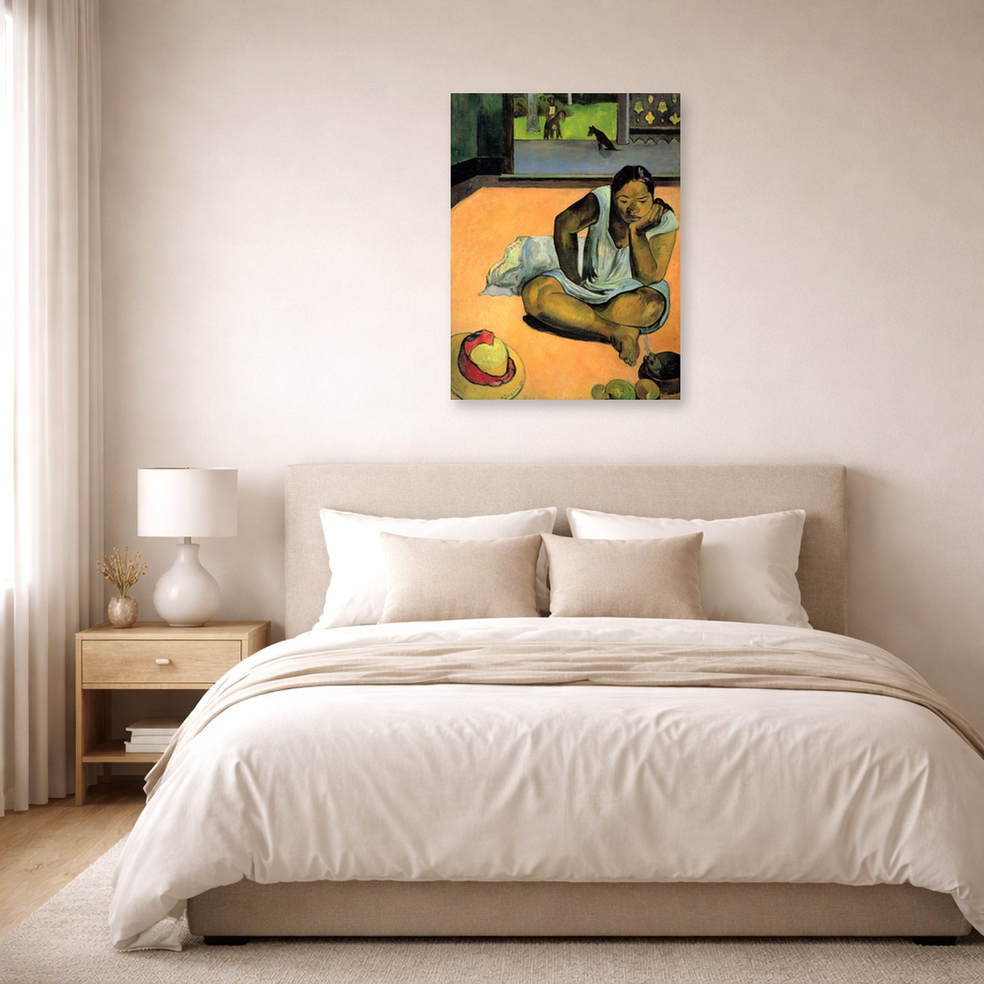 Unframed poster print of Paul Gauguin's The Brooding Woman displayed on a wall in a bedroom
