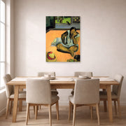 Unframed poster print of Paul Gauguin's The Brooding Woman displayed on a wall in a dining room