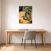 Unframed poster print of Paul Gauguin's The Brooding Woman displayed on a wall in an office